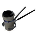 Tongs gripping an induction crucible for metal melting operations