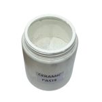 Ceramic paste being applied between furnace insulation panels with a spatula