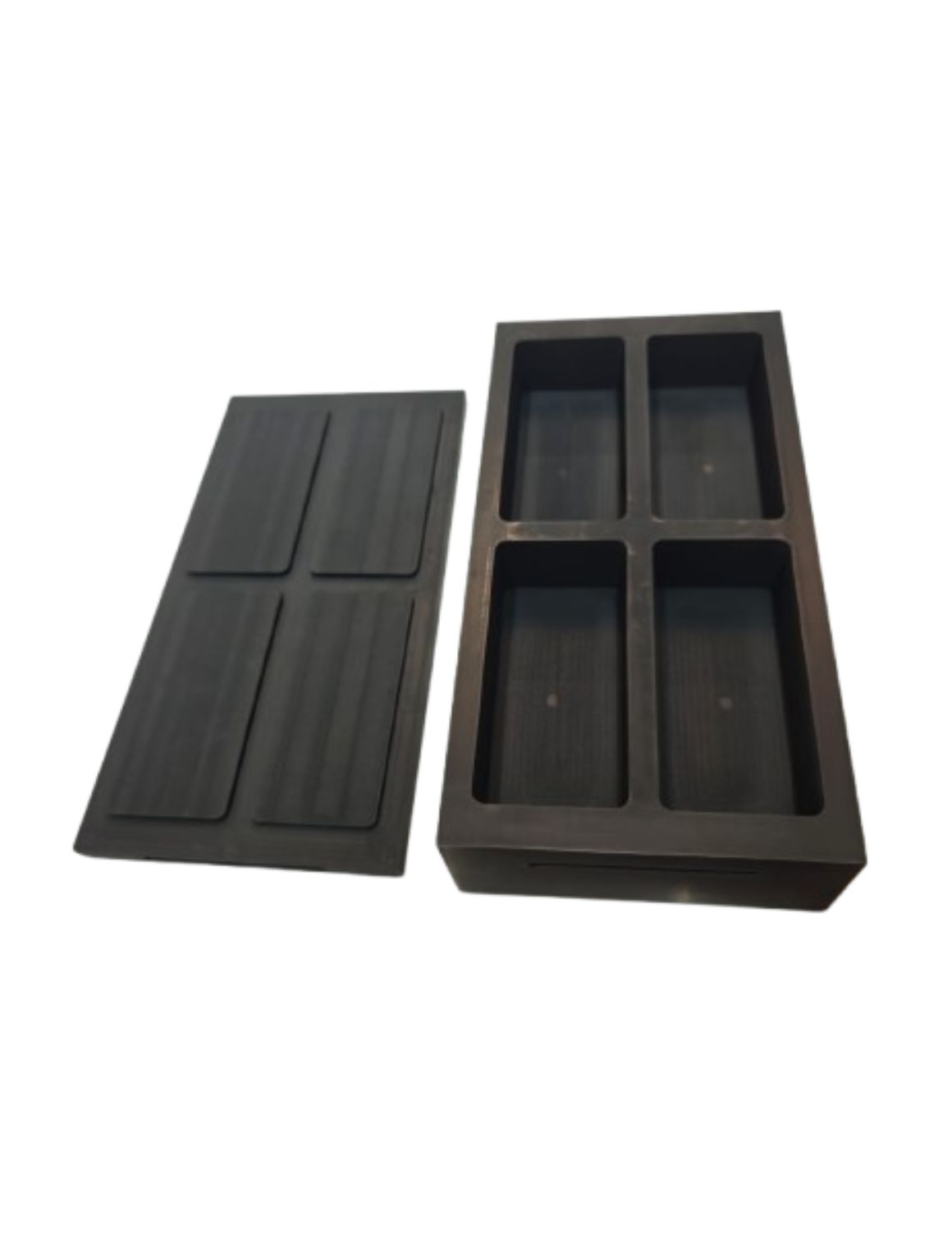 four cavity graphite ingot mould for casting gold and silver bullion bars in gold refining industry.